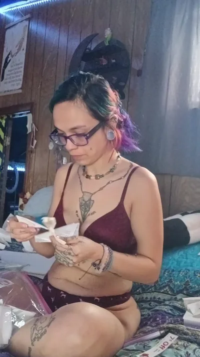 Nerdy girl with glasses and tattoos gets ready for a wild night with Savage Siren's bra and pantytax