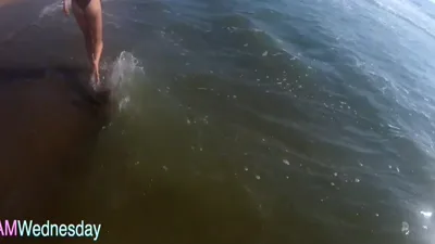 Sexy MILF Amwednesday Beach tries on dresses and rides a bike in front of the camera