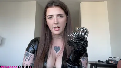 Amyyyoxxo gets humiliated in a kinky PVC chastity cage fetish video