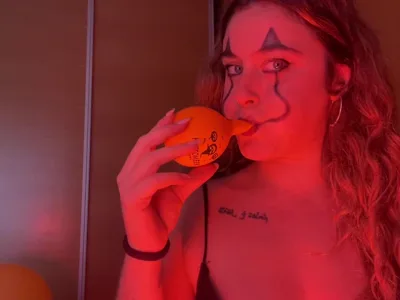 Bee Looner dominates your clown fetish with her feet and latex domination