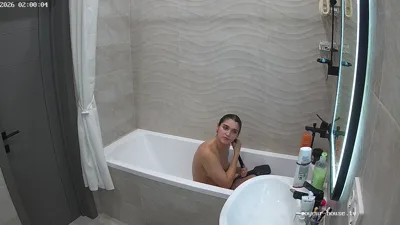 Klara gets naked in the shower and shows off her hot body for voyeurs to watch