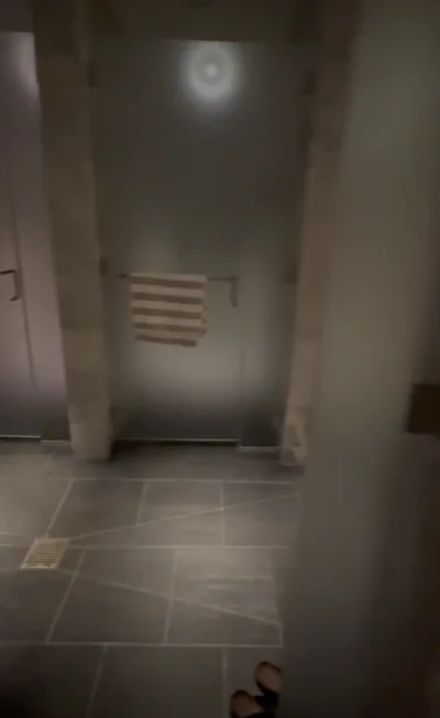 Redfox1075 gets a private shower & door-crack in a spa shower