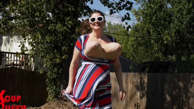 Slow-motion outdoor action with busty KCupQueen bouncing on a trampoline