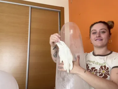 Bee Looner dominates and teases with her giant gloves and giant condom