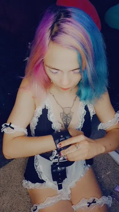Watch as Petite Maid Smoking while Cuffed in Cosplay and Tied up in Manyvids