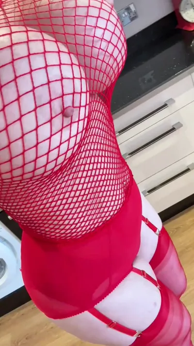 Watch Sophie James, the onlyfans model, get naughty in red fishnet stockings and heels