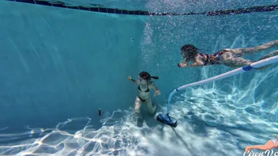 TheUnlimitedGroup's bikini fetish turns into a wild underwater pool party with nudity, girl-on-girl, and nudity-as-a-