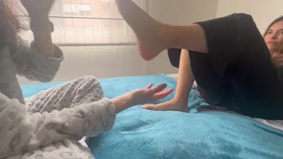 ScarlettandChanel's intense wrestling hold ends in a hot and heavy foot massage
