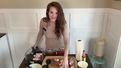 Therealemily34 cooks up Jalapeno Peppers in leggings & food while wearingiery Bacon Wrapping