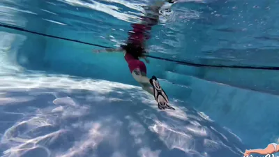 TheUnlimitedGroup goes wild in the pool with Red Latex in a latex suit!