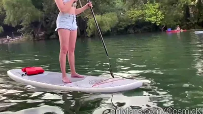 Watch MILF Cosmic Kitti get off with a paddle while posing in public