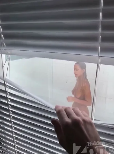 Hidden Zone spycam captures upskirt voyeurism of Ai132's beachcabin shower